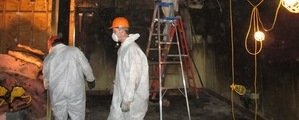 911 Restoration Water-Damage-Restoration-Technician-Working-In-Basement Orange County