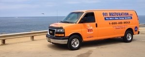 911-restoration Water-Damage-Restoration-Van-Driving-To-Job-Site Orange County