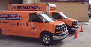 911 Restoration Water-Damage-Restoration-Vans-At-Commerical-Job-Location Orange County
